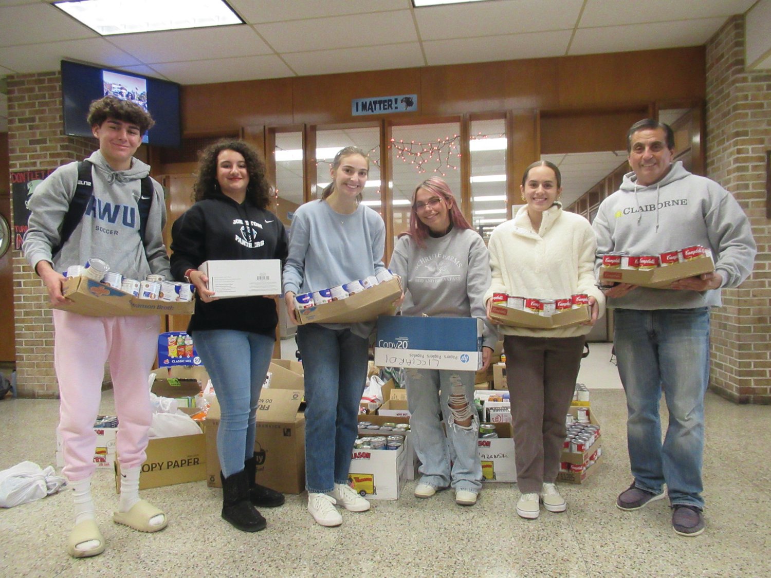 SUPER SUPORTERS: Among those officers of the JHS Chapter of SADD (Students Against Dangerous Decisions) and their classmates who made the annual Food Drive a special success are from left: Dylan Robbins, Vice President Nicki Aucone, Hailey Brown, Secretary Michelina Irons, President Emily Klein and Faculty Advisor Greg Russo.